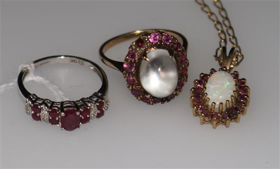 A ruby and diamond 9ct gold half-hoop ring, an opal pendant on chain and a moonstone and ruby dress ring (a.f.)